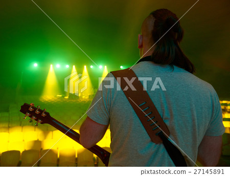 The guitarist plays solo. The guitarist plays solo. 27145891