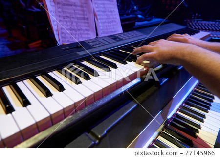 The musician at the rehearsal. 27145966