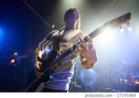 The guitarist plays solo. 27145969