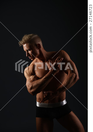 Sexy bodybuilder in briefs posing in his profile Sexy bodybuilder in briefs posing in his profile 27146723