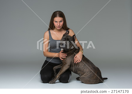 Beautiful girl with grey stafford terrier 27147170