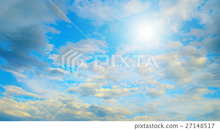 Sun in blue sky and white clouds. 27148517