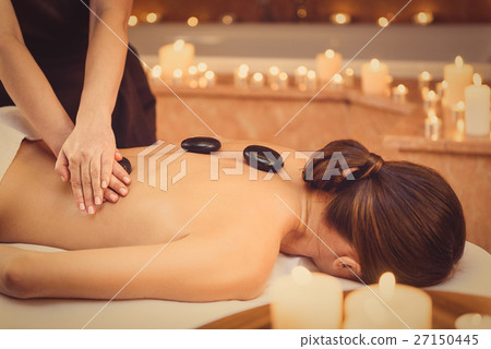 Relaxed girl enjoying body treatment at wellness 27150445