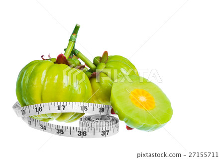 Garcinia cambogia fruit with tapeline, isolated Garcinia cambogia fruit with tapeline, isolated 27155711