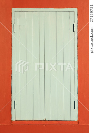Old wooden window on orange wall. Old wooden window on orange wall. 27159731