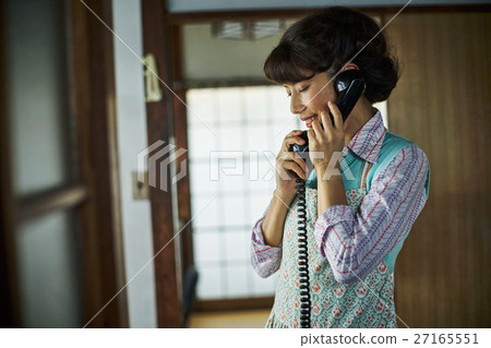 A woman talking on Showa retro phone 27165551