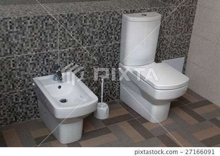 white toilet and bidet 27166091