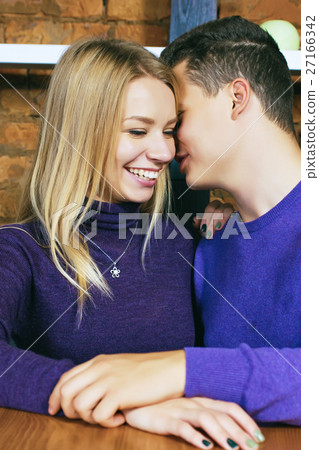 Young couple in love hugging smiling and pressed Young couple in love hugging smiling and pressed 27166342