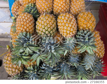Pile of pineapples at asian market, closeup 27166355