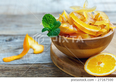 Bowl with candied citrus fruits and sprig of mint. 27167500