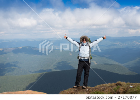 Young Woman hiking in the Mountains. Young Woman hiking in the Mountains. 27170877