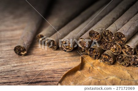 Cigarillo on wooden background 27172069