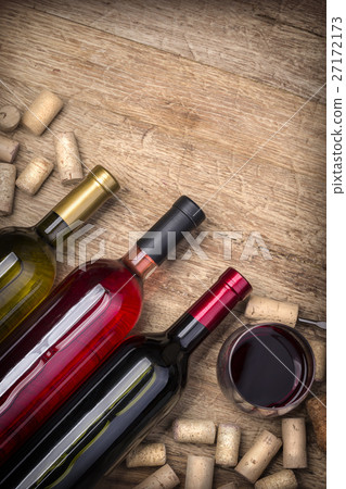 Glass bottle of wine with corks Glass bottle of wine with corks 27172173