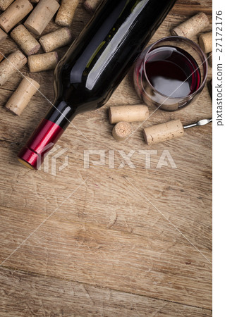 Red wine bottle, glass and corks Red wine bottle, glass and corks 27172176