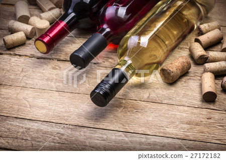 Glass bottle of wine with corks Glass bottle of wine with corks 27172182