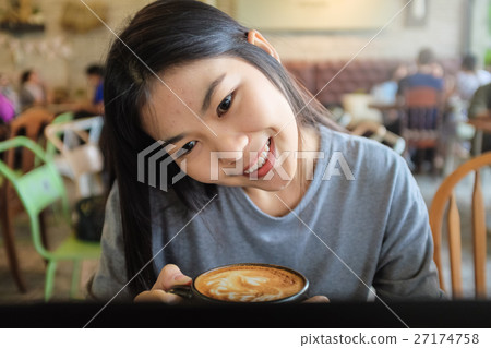 Business woman working on Laptop In Coffee Shop 27174758