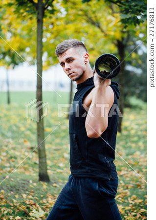 Male fitness doing exercise lunge with vipr Male fitness doing exercise lunge with vipr 27176811