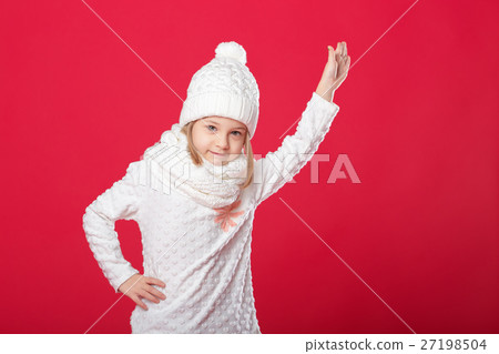 little girl in a white hat and scarf on red backg little girl in a white hat and scarf on red backg 27198504