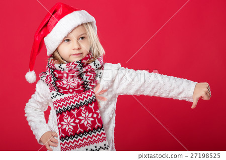 little girl in santa hat on red background little girl in santa hat on red background 27198525