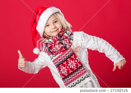 little girl in santa hat on red background little girl in santa hat on red background 27198526