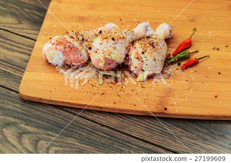 Raw chicken drumsticks with spices, peppers Raw chicken drumsticks with spices, peppers 27199609