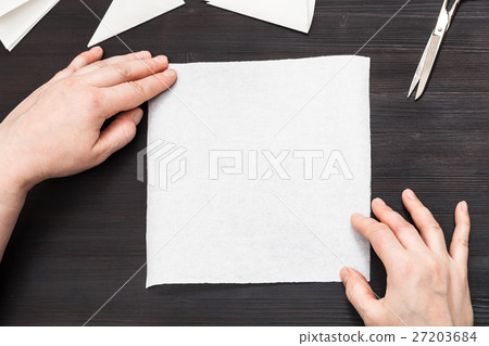 hands hold blank piece of paper on table hands hold blank piece of paper on table 27203684