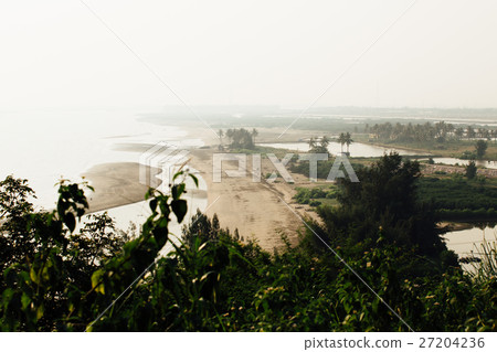 beautiful sandy beach with  view of the mountain 27204236