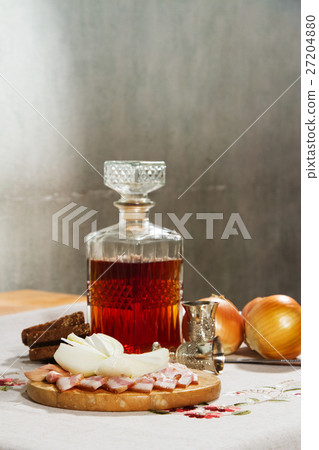 Decanter with vodka is on the table 27204880