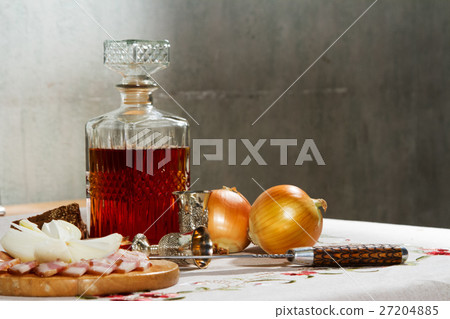 Decanter with vodka is on the table Decanter with vodka is on the table 27204885
