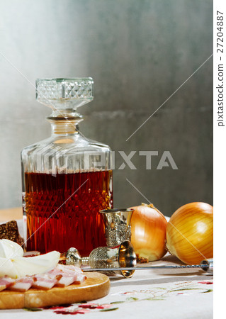 Decanter with vodka is on the table 27204887