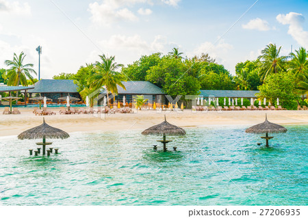 Beautiful tropical Maldives island with white sandy beach and sea . Beautiful tropical Maldives island with white sandy beach and sea . 27206935