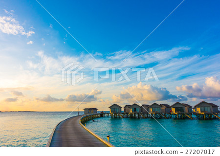 Beautiful sunrise with water villas in tropical Maldives island . 27207017