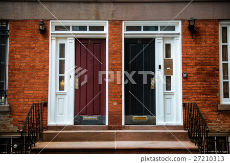 Doors of Two Neighbouring Red Brick Town House 27210313