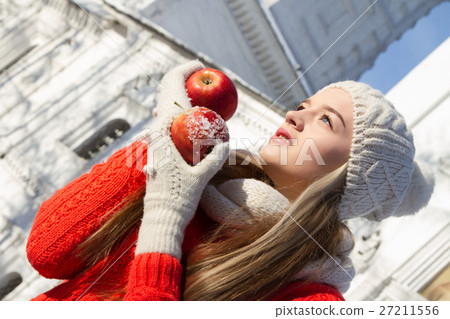 young girl in a sweater on a background of church young girl in a sweater on a background of church 27211556