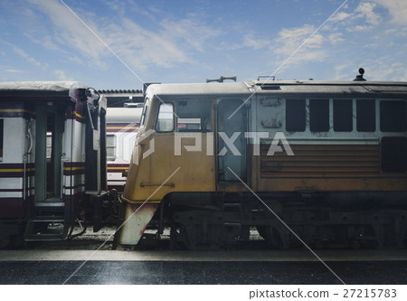 Old yellow train at railway station 27215783