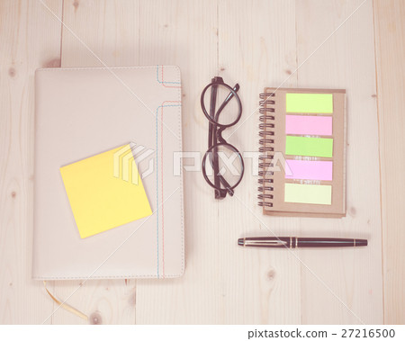 book note with post it on wood background 27216500