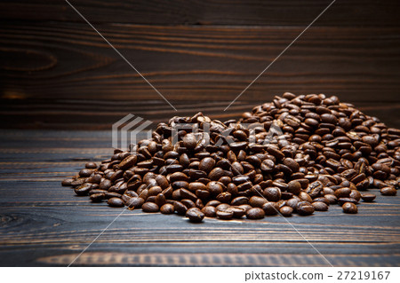 roasted coffee beans on wooden background 27219167