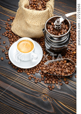 roasted coffee beans on wooden background roasted coffee beans on wooden background 27219268