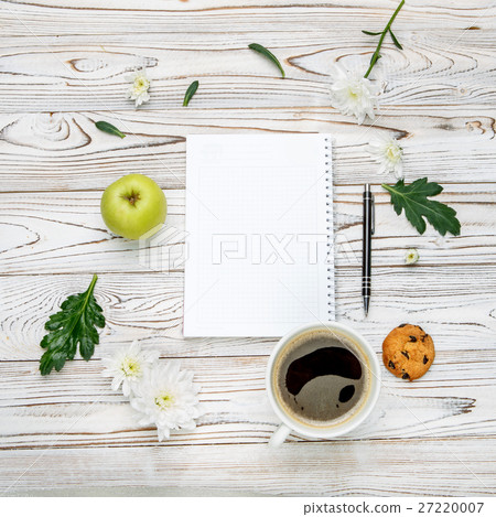cup of coffee and note pad on light wooden table cup of coffee and note pad on light wooden table 27220007