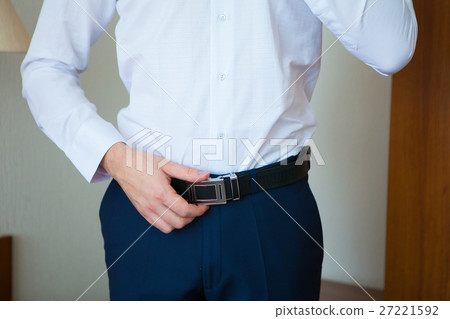 Wedding rings in a blue box, a bridal bouquet of 27221592