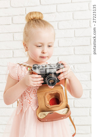 little girl holding a camera little girl holding a camera 27223135