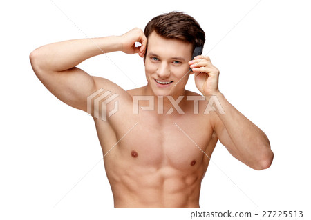 Handsome young man sniffing his armpit Handsome young man sniffing his armpit 27225513