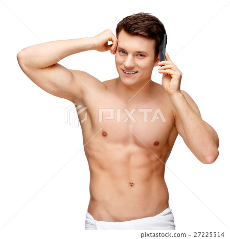 Handsome young man sniffing his armpit Handsome young man sniffing his armpit 27225514
