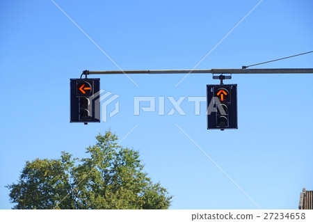 traffic light with red on blue sky background traffic light with red on blue sky background 27234658