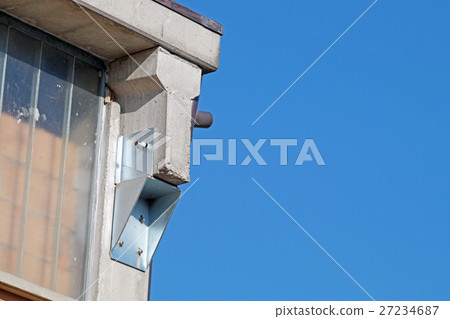 High rise building under construction against blue 27234687