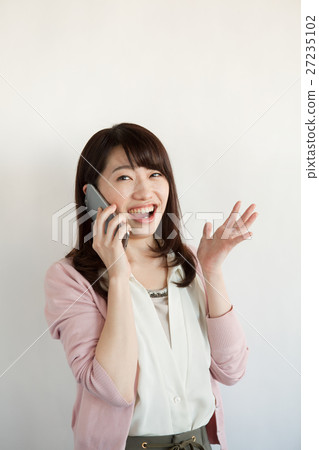 Women in their 20s calling on smartphone 27235102