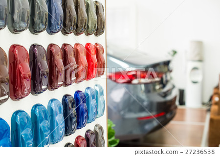 Various car metallic paint samples on stand 27236538