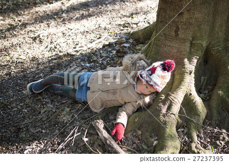 A girl lying down in the shade A girl lying down in the shade 27237395