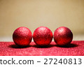 Christmas balls on snow over red background 27240813