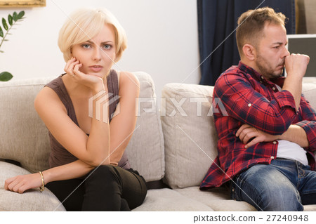 Offended couple man and woman at home Offended couple man and woman at home 27240948